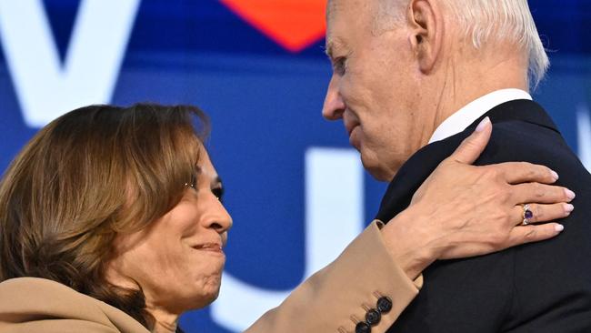 US President Joe Biden and US Vice President and 2024 Democratic presidential candidate Kamala Harris hug on stage after his farewell convention speech on the first day of the Democratic National Convention at the United Center in Chicago. (Photo by Robyn Beck / AFP)