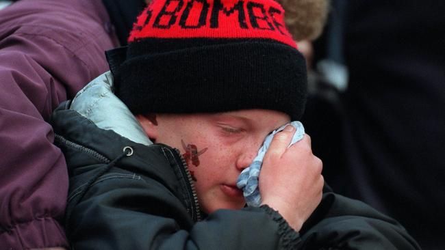 An Essendon football fan crying after the 1999 loss.