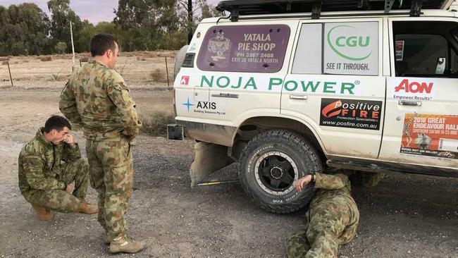 Members of the Australian Army 7th Combat Service Support Battalion inspect the damaged vehicle of the Canetoad Cruisers. Picture: Jarrard Potter