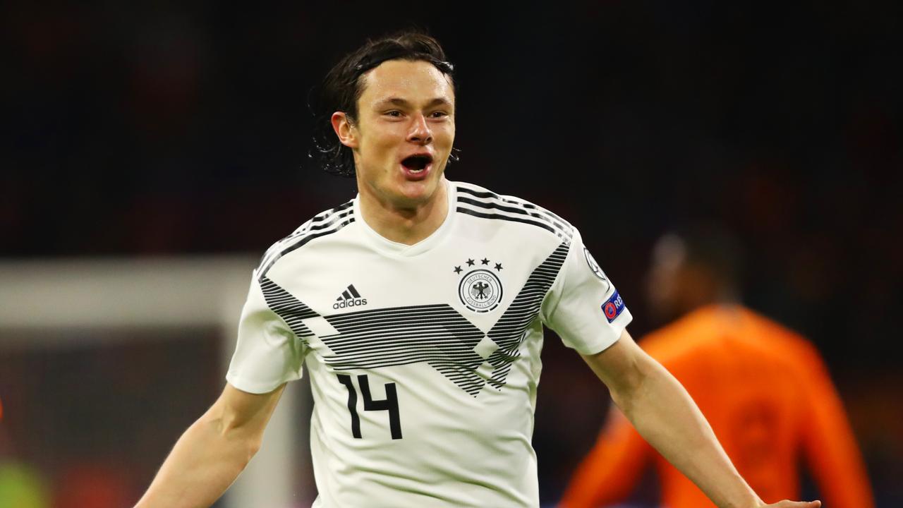 Nico Schulz of Germany celebrates after scoring his team's third goal