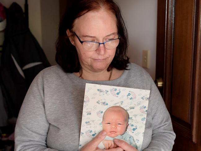 16/8/2018. Julie-Ann Pope poses for photographs with a photograph of her baby boy Joshua Nottle in her Adelaide Hills home, Adelaide. Julie-Ann is still searching for justice as the now discredited forensic pathologist Colin Manock concluded against medical and police advice that Joshua died of natural causes (bronchial pneumonia) despite him having horrific injuries including a broken back. Tracey Nearmy/The Australian