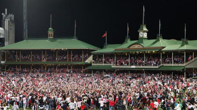 Total mayhem as fans swarm onto the ground to celebrate Franklin’s 1000th career goal. Picture: AFL Photos