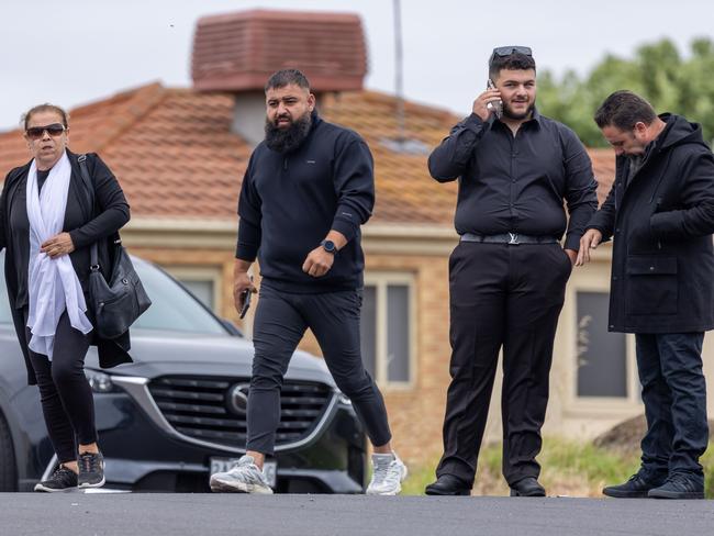 Mourners make their way into the mosque.