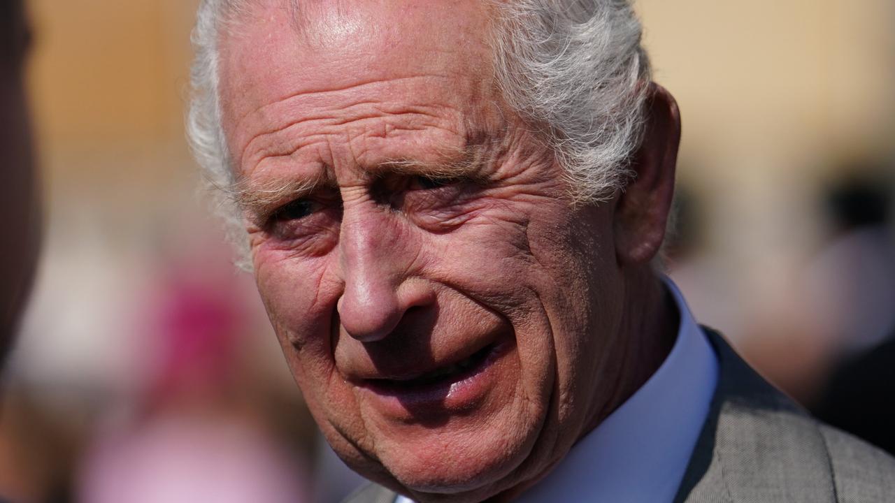 LONDON, ENGLAND - MAY 8: King Charles III speaks to guests attending a Royal Garden Party at Buckingham Palace on May 8, 2024 in London, England.  (Photo by Jordan Pettitt - Pool/Getty Images)