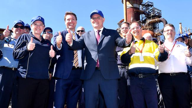 Scott Morrison with staff at Ampol’s L:ytton refinery after the rescue package was announced. Picture: John Gass