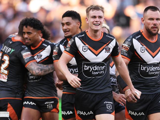 SYDNEY, AUSTRALIA - APRIL 01:  Lachlan Galvin of the Tigers celebrates victory with team mates after the round four NRL match between Parramatta Eels and Wests Tigers at CommBank Stadium, on April 01, 2024, in Sydney, Australia. (Photo by Matt King/Getty Images)