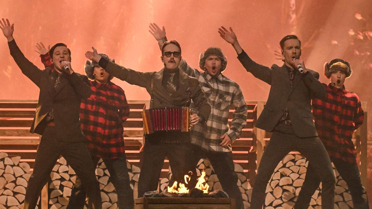 Sweden’s KAJ celebrate a good sauna and lumberjack fashion. Picture: Sebastien Bozon / AFP.