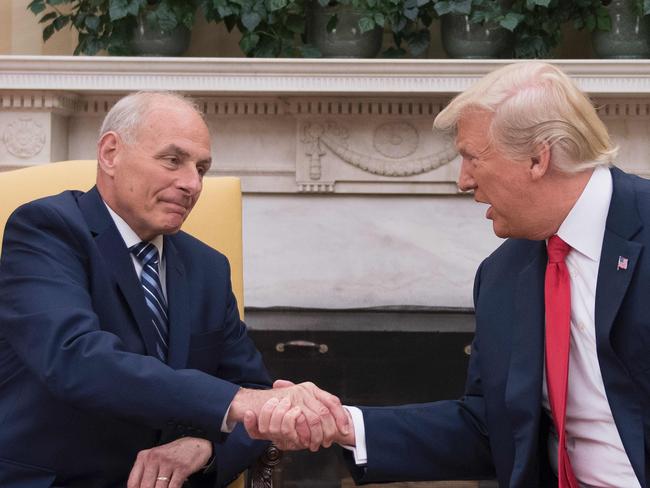 Mr Trump shakes hands with newly sworn-in White House Chief of Staff John Kelly at the White House in Washington, DC, in July. Picture: Jim Watson/AFP