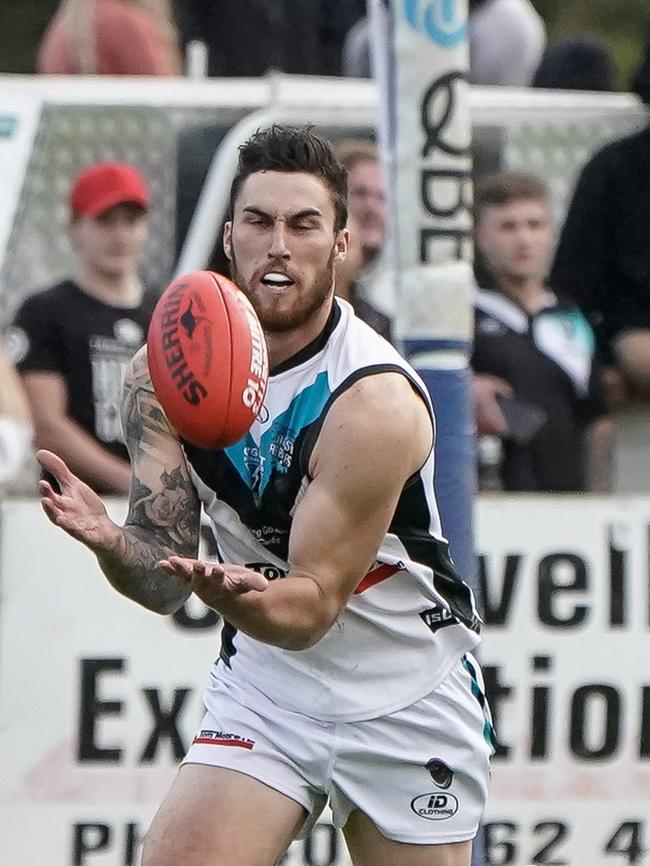 Ryan Wiggins in action for Cygnet against Huonville on Saturday April 17th. Photo courtesy of David Clark Photos