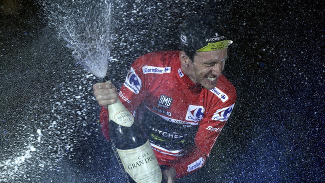 British rider Simon Yates of the Mitchelton-Scott team celebrates on the podium after winning the La Vuelta cycling race in Madrid, Spain, Sunday, Sept. 16, 2018. (AP Photo/Manu Fernandez)