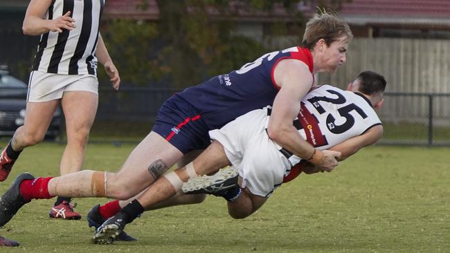 SFNL: Chelsea Heights’ Angus Macpherson takes down Brodie Templeton of Heatherton. Picture: Valeriu Campan