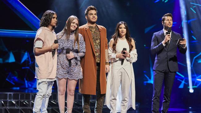 Adam Lambert in 2016 with X Factor contestants Isaiah Firebrace, Amalia and Natalie Ong.