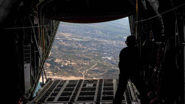 A German Armed Forces Bundeswehr drop relief goods over the Gaza Strip from a C-130 transport airplane.