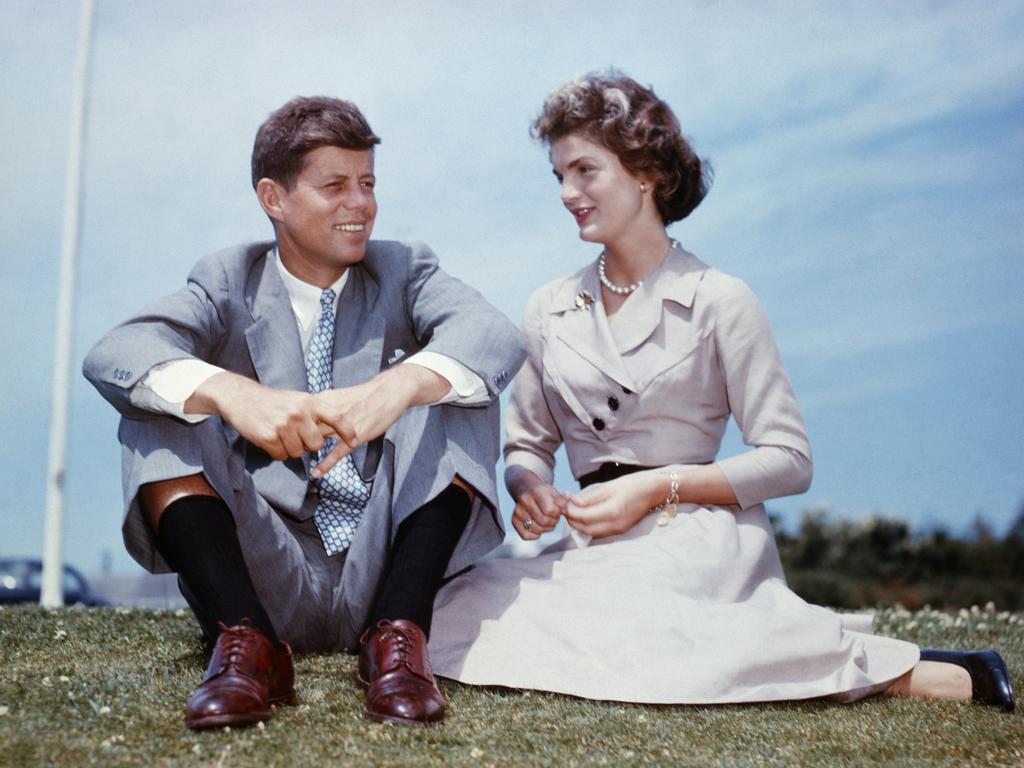 From student to First Lady … Jacqueline Bouvier with John F. Kennedy outside his family home at Hyannis Port, Massachusetts, a few months before their wedding.