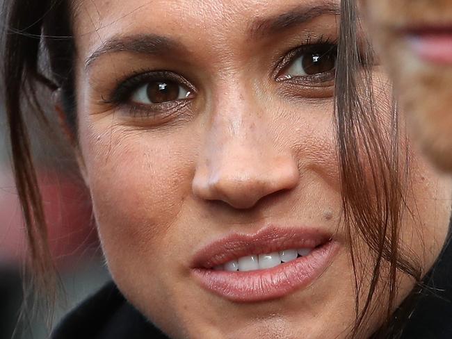 CARDIFF, WALES - JANUARY 18:  Prince Harry and fiance Meghan Markle during a walkabout at Cardiff Castle on January 18, 2018 in Cardiff, Wales.  (Photo by Chris Jackson/Getty Images)