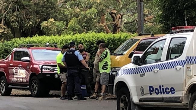 Police talking to building workers outside a home at Seaforth following an explosion while two men were workimnmg in a bathroom on the premises. Picture: Jim O'Rourke