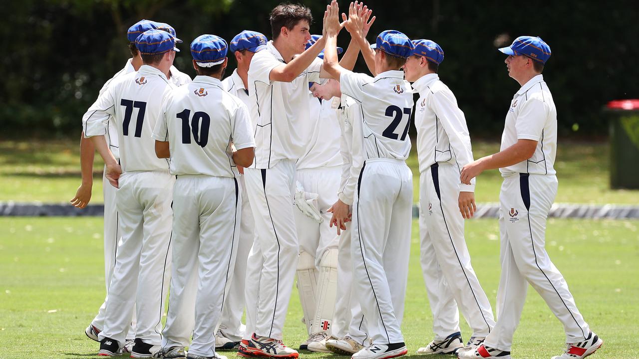 Jem Ryan, middle, without a cap, celebrates with his team after getting a wicket. Picture: Tertius Pickard