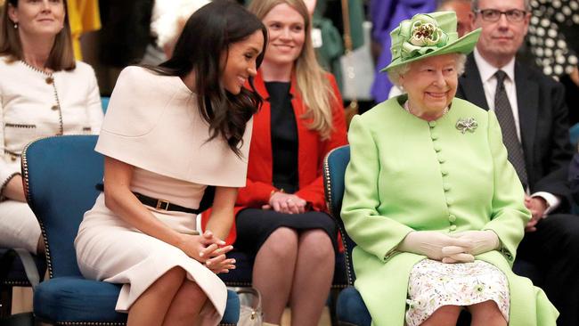 Meghan and the Queen share a laugh on their visit to Storyhouse in Chester. Picture: AFP.