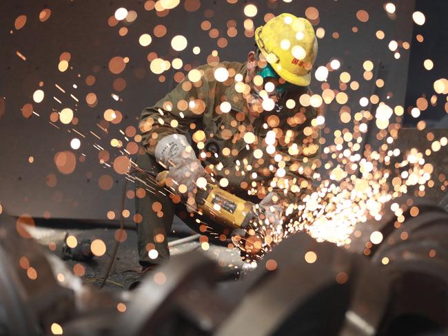 A worker welds metal at a factory in Hangzhou, Zhejiang province, as China reports its economy grew 6.3 per cent year on year in the second quarter, a figure that belies the country's slowing post-pandemic recovery. Analysts warn the number is inflated given the low base of comparison with lockdown-wracked 2022. Picture: AFP