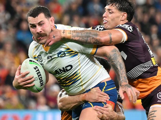 BRISBANE, AUSTRALIA - AUGUST 23: Reagan Campbell-Gillard of the Eels is tackled during the round 25 NRL match between Brisbane Broncos and Parramatta Eels at Suncorp Stadium, on August 23, 2024, in Brisbane, Australia. (Photo by Matt Roberts/Getty Images)