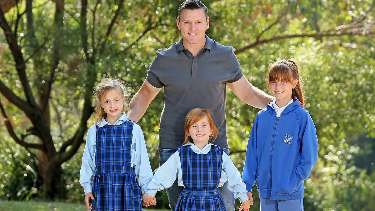 Edie, when 12, with father Matthew Burke and sisters Giselle 6 and Zsa Zsa 5.