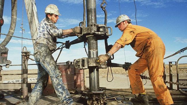 Riggers working at a Santos well in the Cooper Basin in the 1990s.