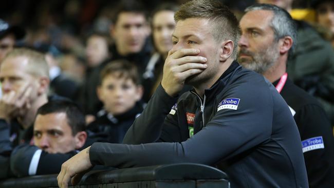 Injured Magpie Jordan De Goey watches from the sidelines. Picture: Michael Klein