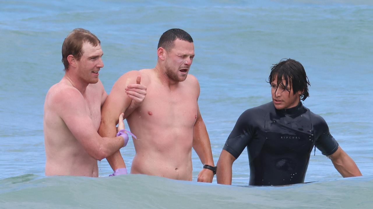 Demons in Lorne: Steven May recovers after his surf board flipped over. Picture: Brendan Beckett