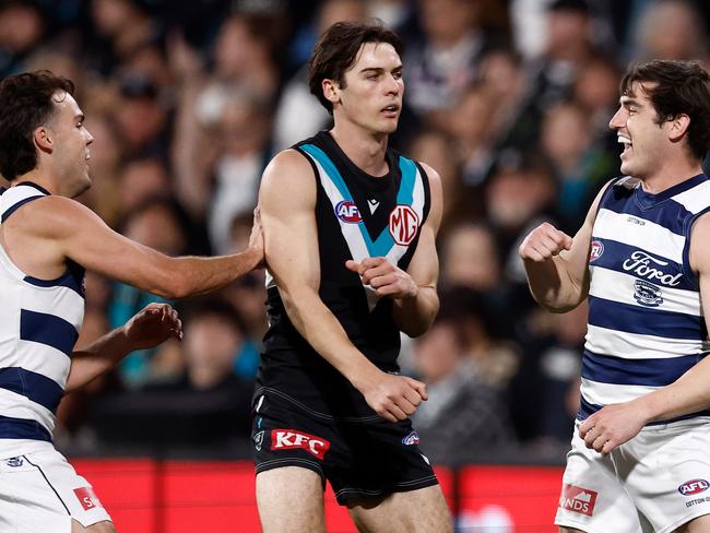 Shaun Mannagh and Jack Bowes celebrate in front of Connor Rozee. Picture: Michael Willson/AFL Photos