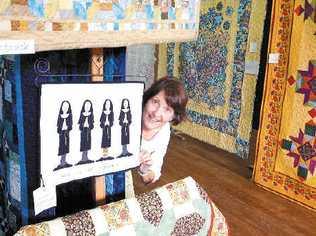 Elizabeth Casmir president of Bangalow Quilters Incorporated prepares for the quilt show at the All Souls Anglican Church Hall in Bangalow today and tomorrow.