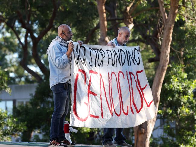 Pro Palestine roof top protesters Subhi Michael Awad and  Waddah Weld Ali  detained by police, UQ St. Lucia campus. Picture: Liam Kidston