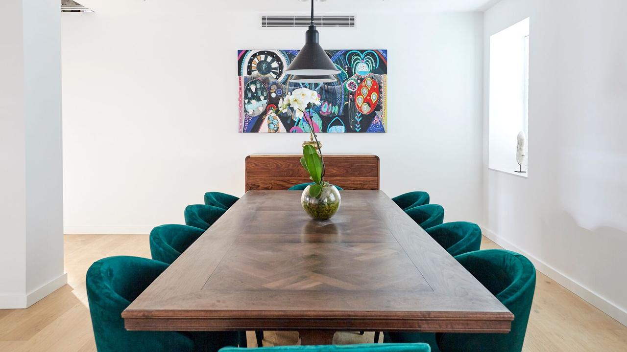 The custom-made Christian Cole table is stunning with the velvet, emerald green chairs. Source: The Block