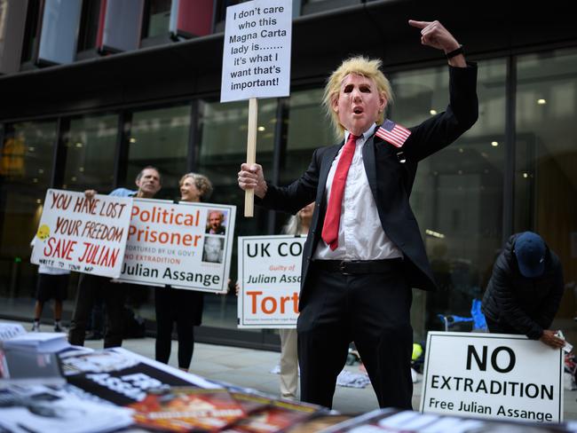 A Trump mask-wearing protester at the court. Picture: Getty