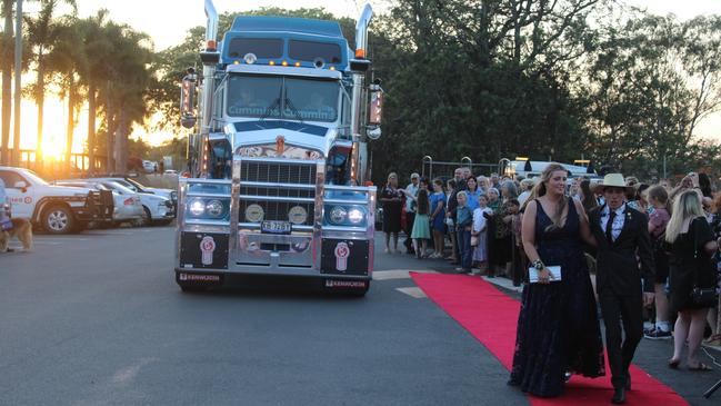 Kayla McCotter and Cody Dingle made the biggest entrance in a Kenworth W900 Legend Prime Mover to the 2023 Gin Gin State High School Formal.