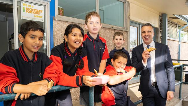 Premier Peter Malinauskas enjoys a feed with Clovelly Park Primary School students Saleh, Sneha, Ryan, Max and Felix. Picture: NCA NewsWire / Morgan Sette