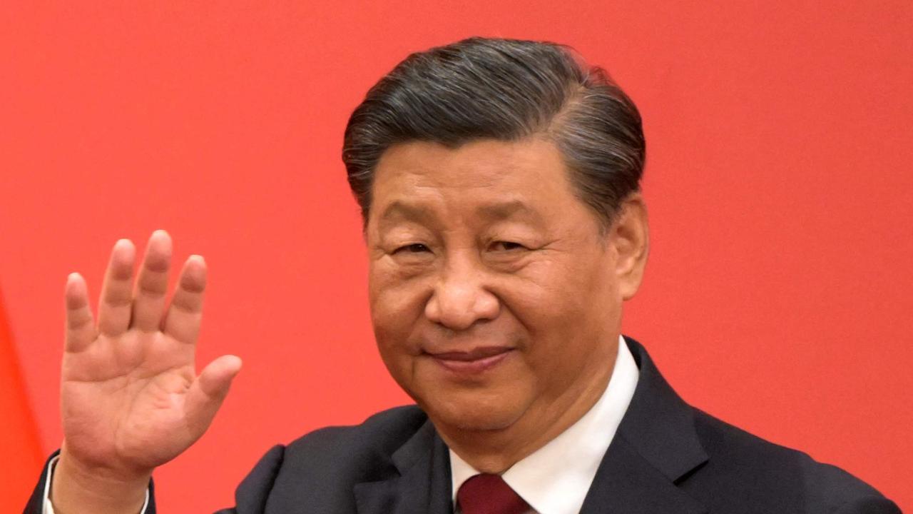 China's President Xi Jinping waves to the media this month. Picture: AFP