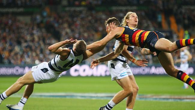 Joel Selwood came off second best in this collision with Andy Otten. Picture: Getty Images