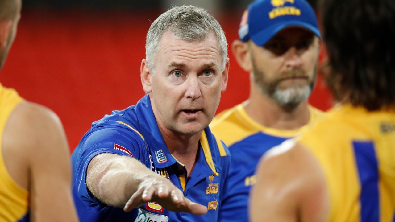 GOLD COAST, AUSTRALIA - SEPTEMBER 17: Adam Simpson, Senior Coach addresses his players during the 2020 AFL Round 18 match between the North Melbourne Kangaroos and the West Coast Eagles at Metricon Stadium on September 17, 2020 in Gold Coast, Australia. (Photo by Michael Willson/AFL Photos via Getty Images)