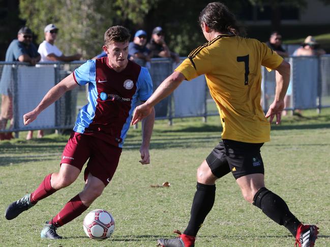 Coomera’s Angus Hughes takes on Mudgeeraba’s Anthony Blyde. Picture: Mike Batterham