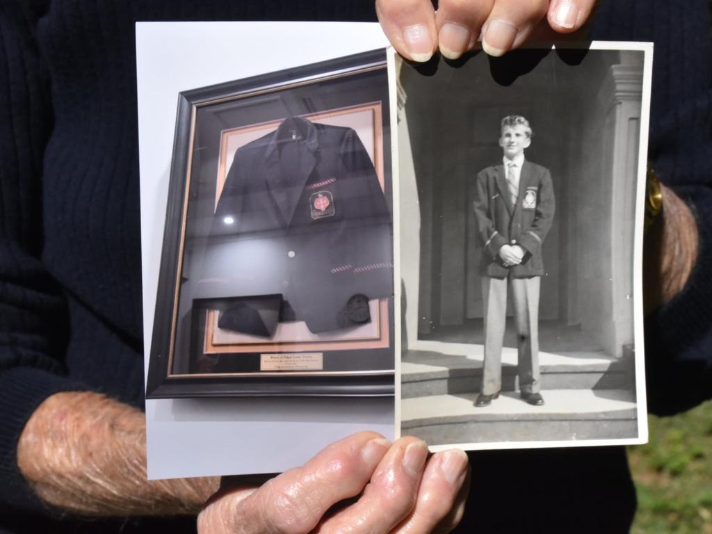 Audrey Camilleri holding her 15-year-old brother’s photo and a photo of the Rockhampton School blazer he which was found in the wreckage before being donated to the grammar school. Photo: Luke Lay