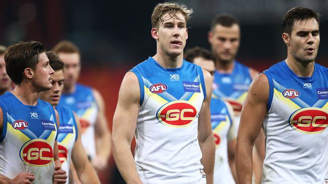 Tom Lynch leads the Gold Coast Suns off the ground following another loss. Picture: Getty Images