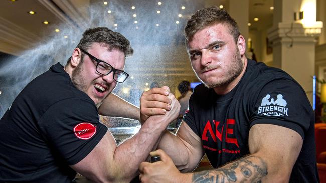 Arm wrestlers Taran Broad and Thylor Harrison at Sebastyan's Bar at the Grand Chancellor Hotel. Picture: Mark Brake