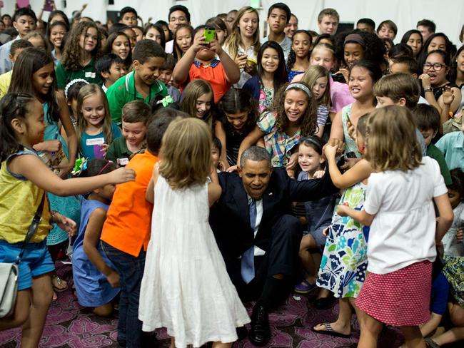 April 28, 2014: “’Help me up!’, the President beckoned after posing for a photograph with children at the U.S. Embassy in Manila, the Philippines.” Picture: Official White House Photo by Pete Souza