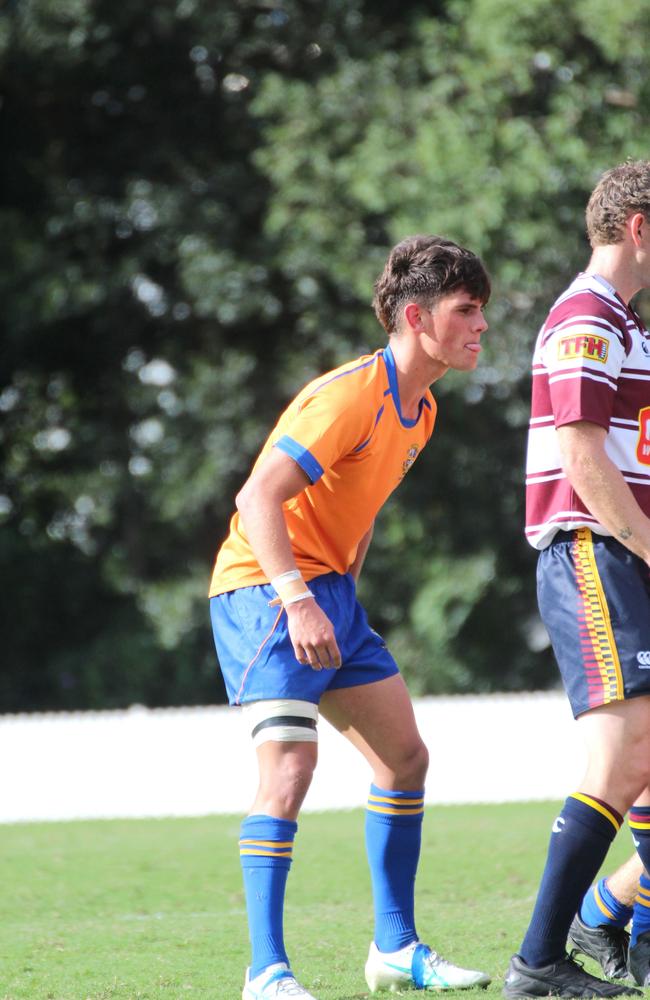 Lachlan McCall looking to apply pressure on his opposing halfback during a scrum.