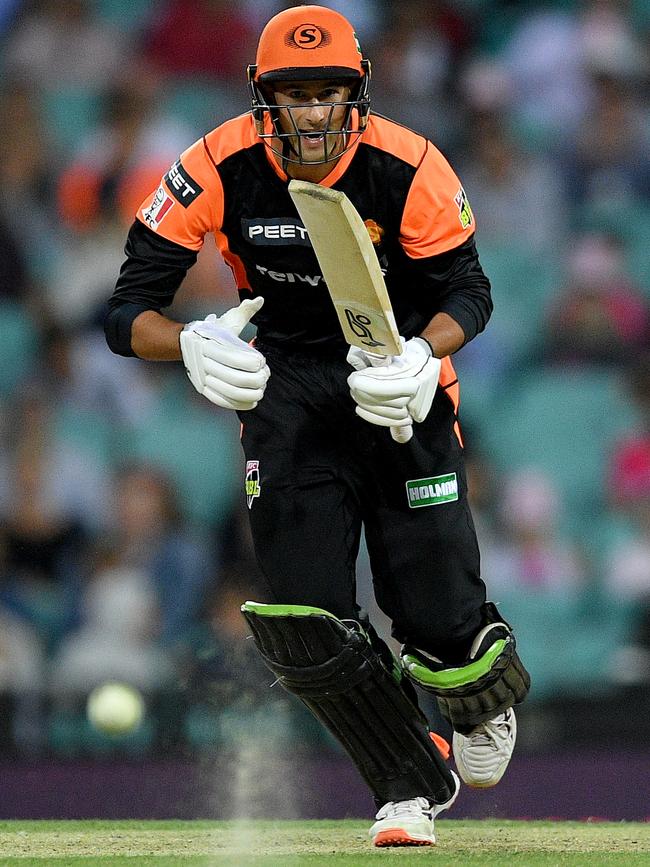 Ashton Agar watches his shot stir up some sand. Picture: AAP