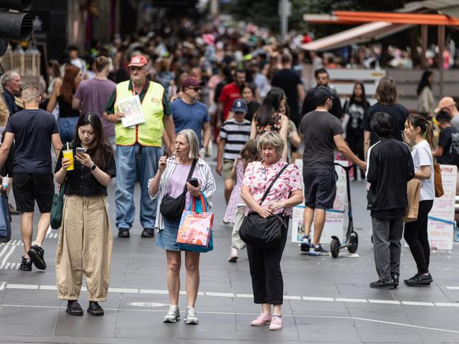 MELBOURNE, AUSTRALIA - NewsWire Photos - 14 DECEMBER, 2024: People carry shopping bags along Bourke Street Mall.  Picture: NewsWire / Diego Fedele