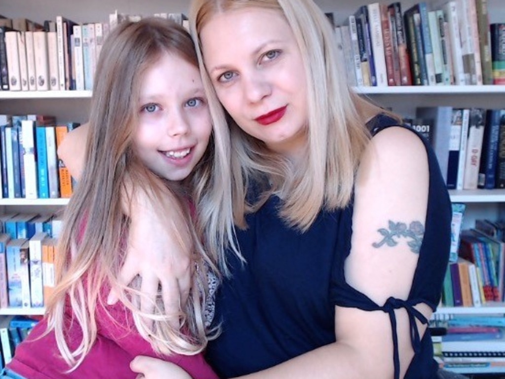 Amra, pictured with her 10-year-old daughter, says writing a memoir about her childhood trauma was cathartic.