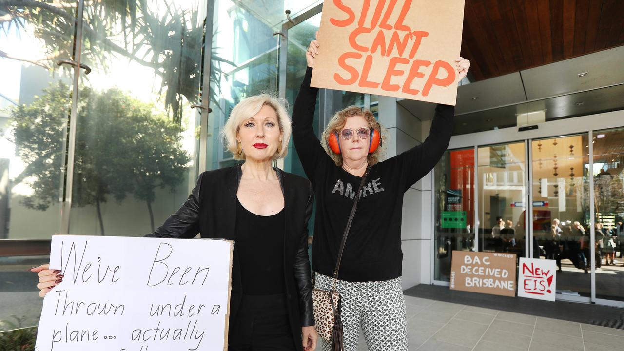 Rosanne Broedelet, New Farm, and Karen Brown, Teneriffe, rallying outside Brisbane Airport Corporation against fight noise in June. Pics Tara Croser.