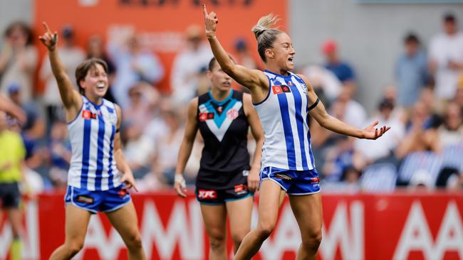 MELBOURNE, AUSTRALIA - NOVEMBER 23: Alice O'Loughlin of the Kangaroos celebrates a goal during the 2024 AFLW First Preliminary Final match between the North Melbourne Tasmanian Kangaroos and the Port Adelaide Power at IKON Park on November 23, 2024 in Melbourne, Australia. (Photo by Dylan Burns/AFL Photos via Getty Images)