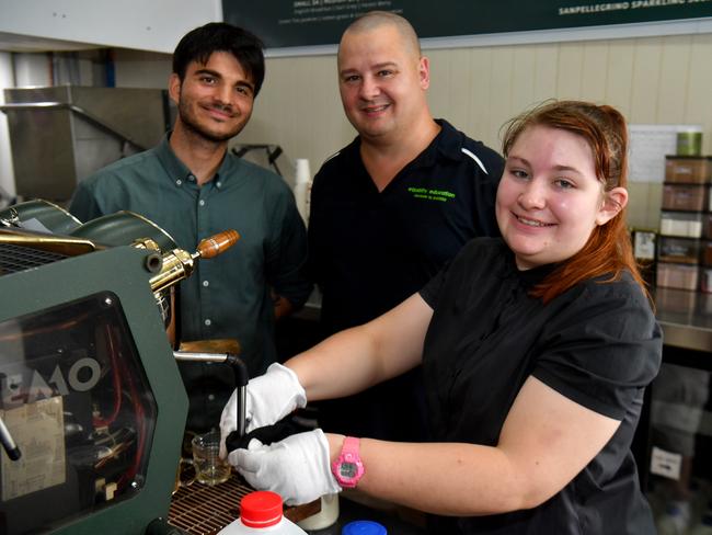 Equality Education student Hannah Dawson practising her barista skills, with barista Chris Nilsson and Equality Education CEO Arthur Burchett, at Coffee Presto in Rosslea. Picture: Evan Morgan